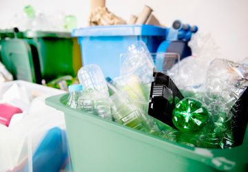 Used-plastic-bottles-recycling-bins-earth-day-campaign_53876-104848